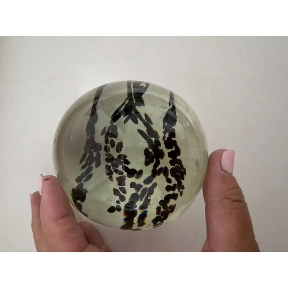 Vintage art glass paperweight with black Inclusions